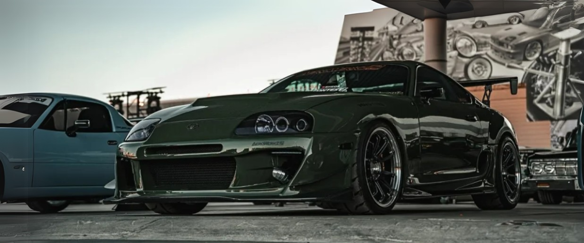 Pros and Cons of Car Vinyl Wrapping - Wrapford Drak green vinyl wrap car image